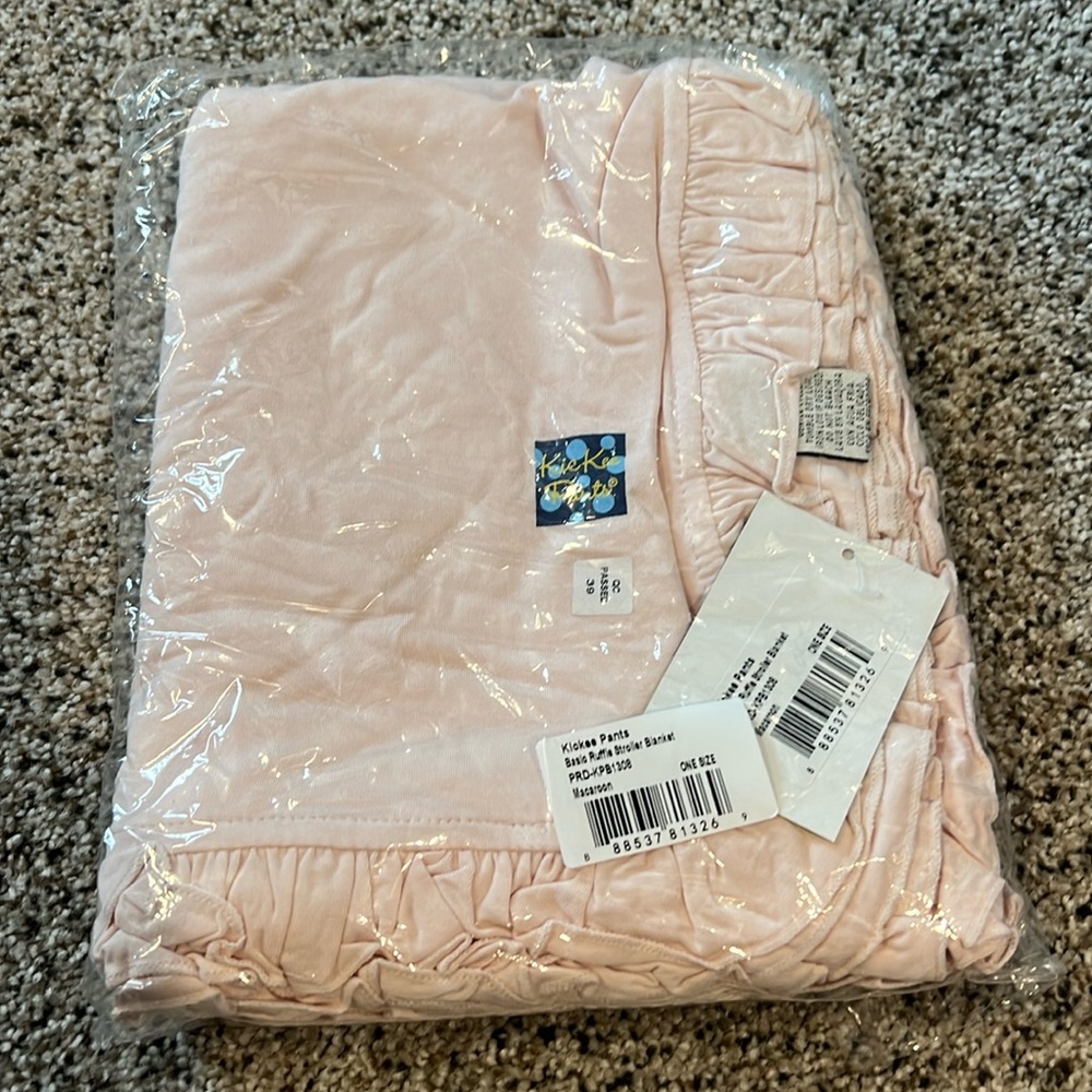 NIB kickee pants ruffle stroller blanket in macaroon (light pink).